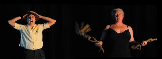 Andre Keichian as Young Boy (left) and Nell Ruby as Stripper (right) in the performance Standing Outside with my Mouth Open Wide, (2011). The project is a series of vignettes where the artists dress and sing to each other assuming dreamed-up identities.