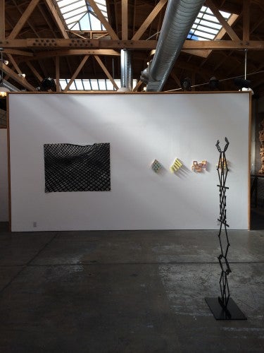 Installation view of "RR&P," with works by (l to r) Kim Beck, Construction Fence, charcoal on paper; Alex Paik, Prelude and Fugue, gouache, marker, colored pencil on paper; and Megan Cotts, Fig. 5, aluminum.