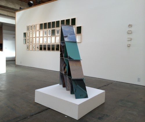 Installation view of "RR&P," with works by (l to r) Corey Escoto, Wheel of Fortune: I’d Like to Solve the Puzzle, digital prints, frames, Plexiglas; Corey Escoto, House of Cards, digital prints, wax balls); and Lilly Zuckerman, 6”x4.5”x3”, 4”x4”x3”, 5”x3”x3.5”, porcelain.