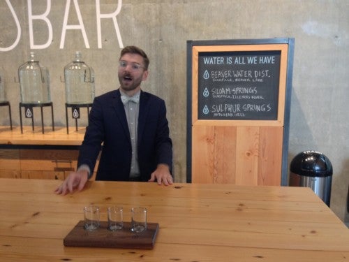 Curator Chad Elligood at Works Progress's Water Bar, water tasting flights. 