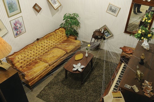 Jonathan Schipper, Slow Room, 2011/2012/2014; installation: household furniture, cables, pulley, and electric motor. (Courtesy of the artist and Pierogi Gallery.)