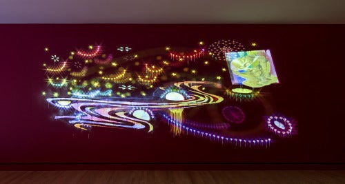 Dave Greber’s work stems from a preoccupation with the transcendental artificiality that sprouts from the arena of popular culture. On view at “State of the Art” is Greber’s Sinew-en-ciel, 2014, which comprises of high-def video projection, acrylic, and rhinestones. (Photo: Dero Sanford)