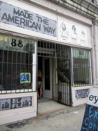 Ashley Anderson, Down on the Street (2044), 2014; wheat paste and static cling vinyl, dimensions variable, Image courtesy of the artist.
