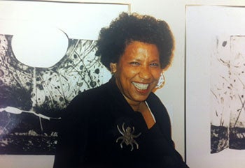 Mildred Thompson standing before works in her "Mystery" series.