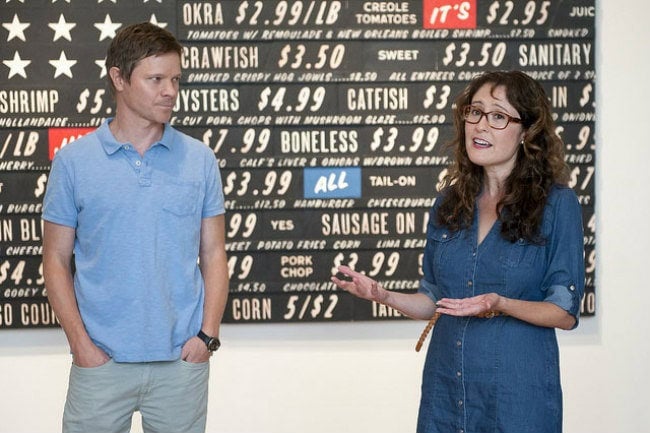 "Southern Accent" curators Trevor Schoonmaker (l) and Miranda Lash (r) in front of Skylar Fein's Soul Food Flag for Elizabeth's