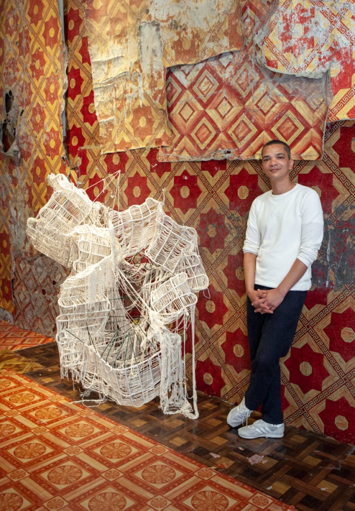 Artist Igshaan Adams in his exhibition Getuie at the SCAD Museum of Art.