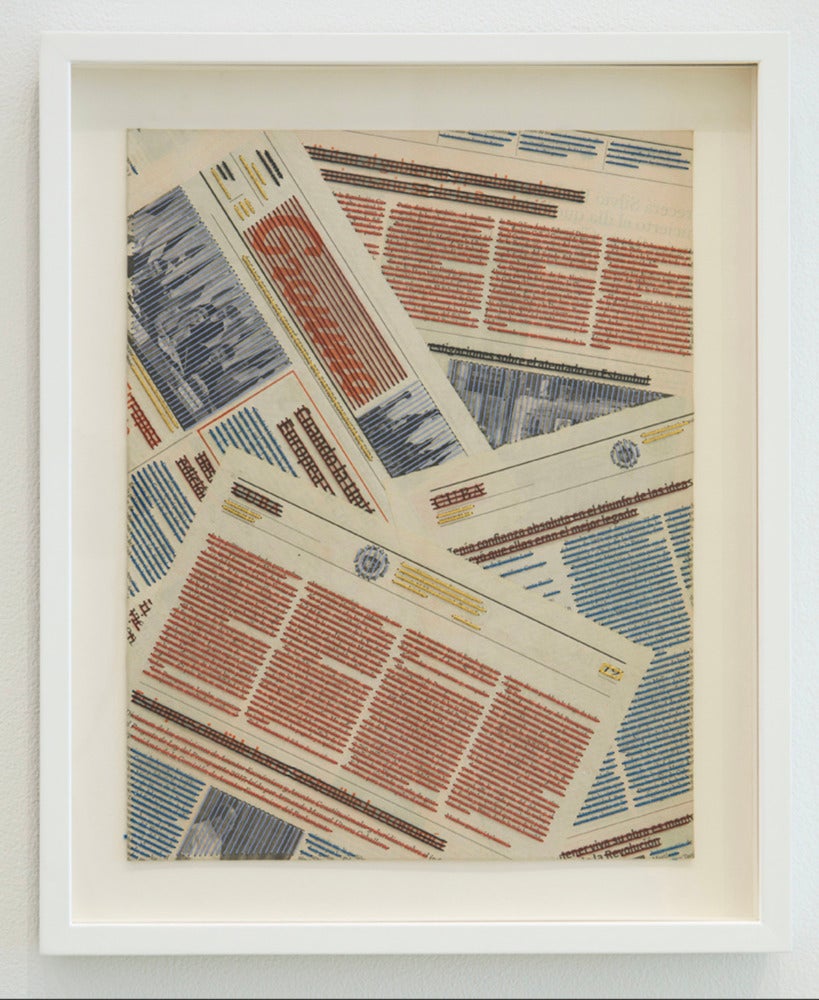 a framed photo of strike through newspaper articles.