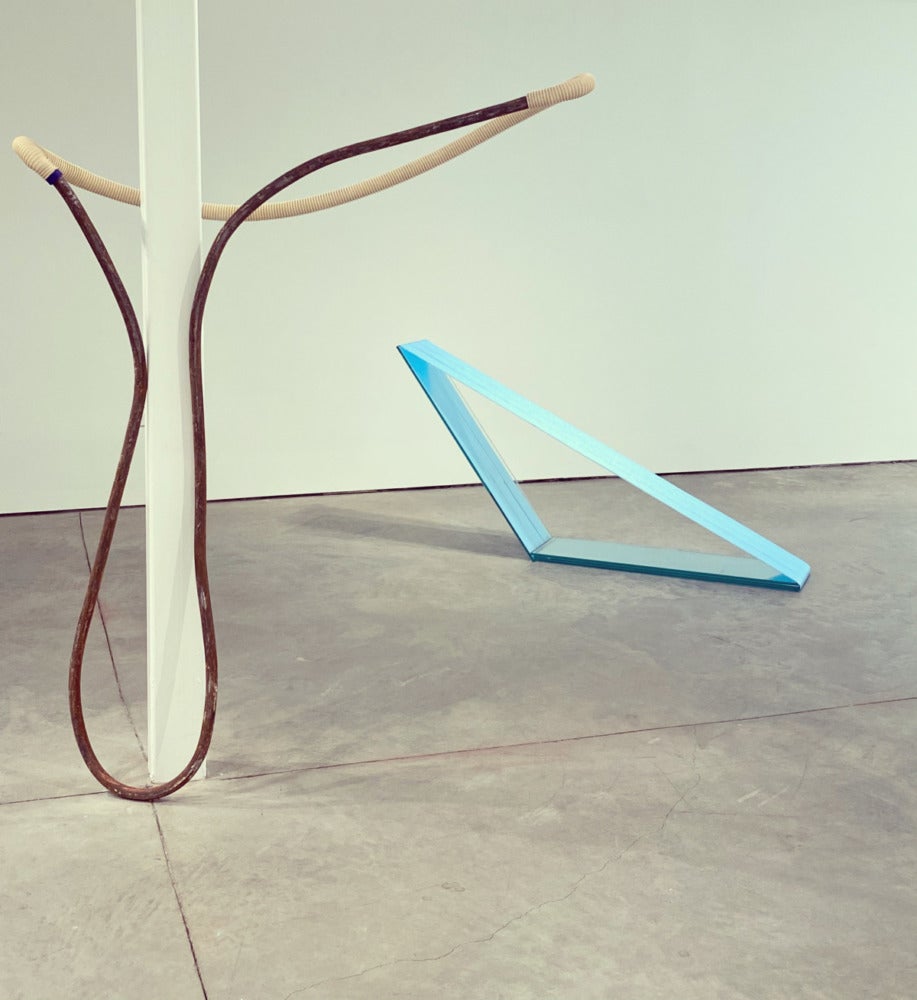 different colored sculptures made of pipe.