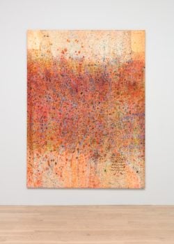red orange and white painting on white wall with wood floor