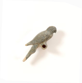 installation image of paper mache bird on pole
