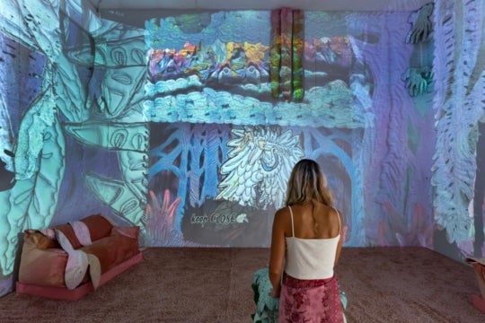 installation image of woman playing video game